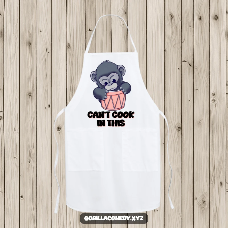 Funny gorilla chef apron featuring a curious primate attempting to fit into a tiny drum, adding humor to cooking.