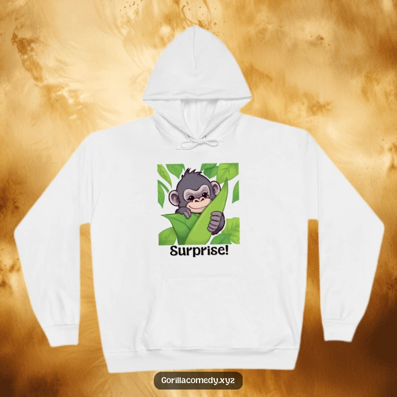 Funny hoodie featuring a mischievous gorilla hiding behind a jungle leaf, winking playfully, offering warmth and jungle-inspired fun.