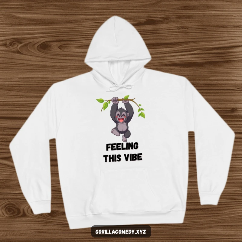Funny hoodie featuring a joyful gorilla swinging from a vine with a triumphant yell, offering comfort and exhilarating jungle energy.