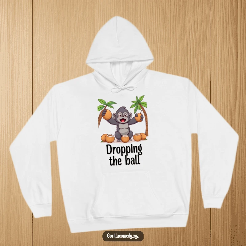 Funny Kawaii gorilla in a focused yet clumsy pose, juggling coconuts on a comfortable and humorous hoodie.