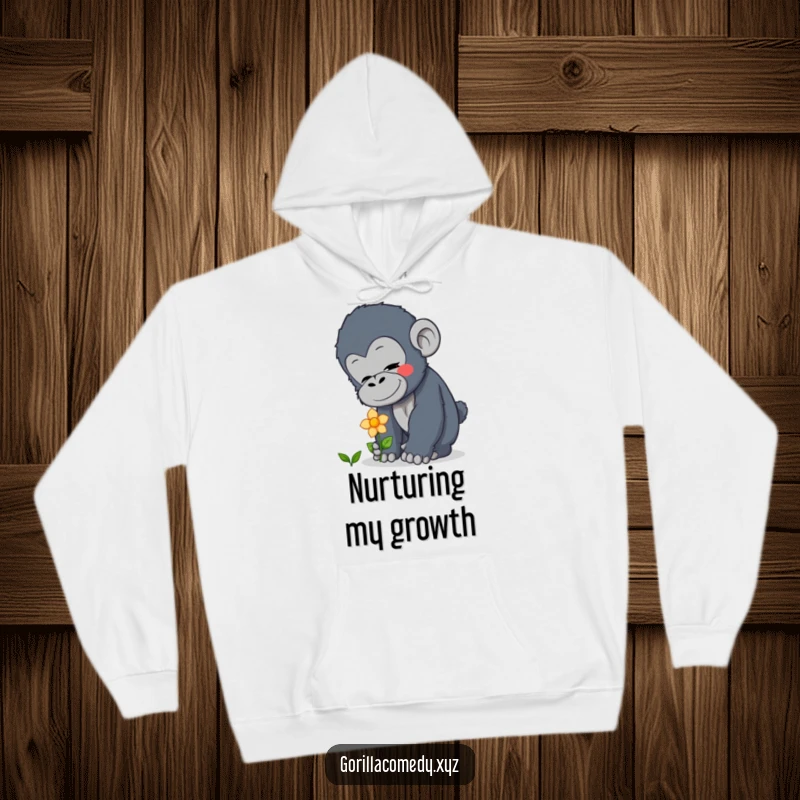 Funny curious gorilla hoodie featuring a gentle character patting a flower, offering comfort and warmth, a thoughtful funny gift.