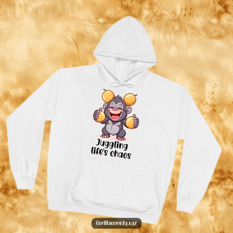 Funny giggling gorilla hoodie with a wide grin juggling three shiny coconuts, offering warmth and a playful vibe, a fantastic funny gift.
