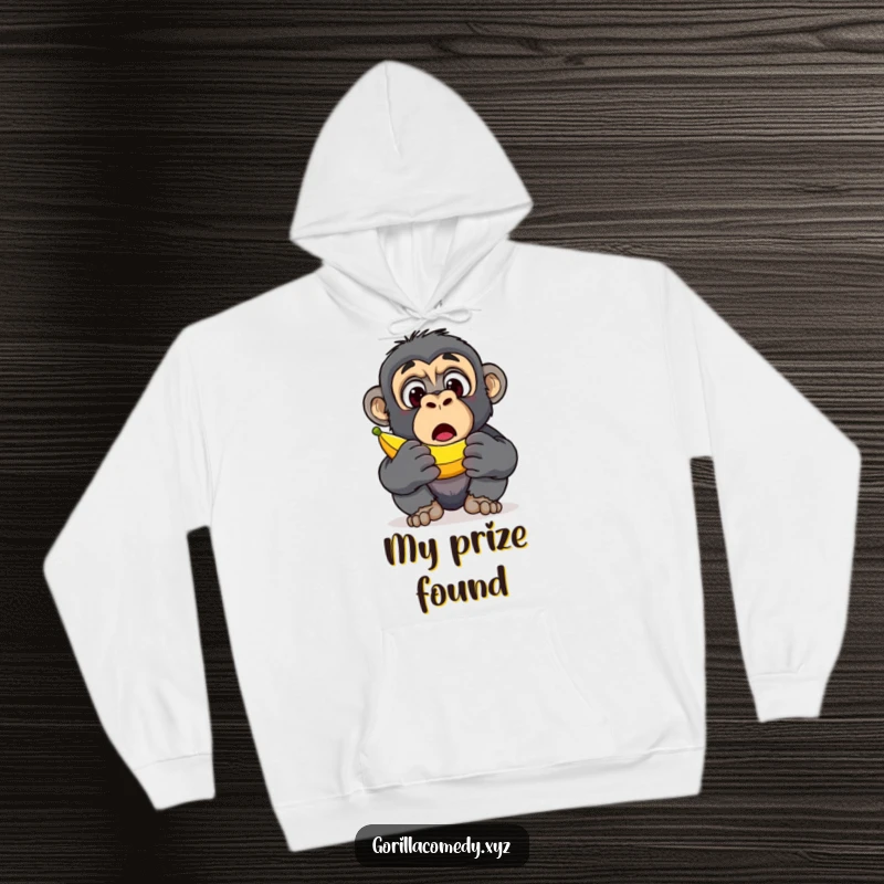 Funny Gorilla Banana Discovery Hoodie: A warm hoodie with a surprised gorilla character's wide eyes upon discovering a banana, perfect for funny gifts.
