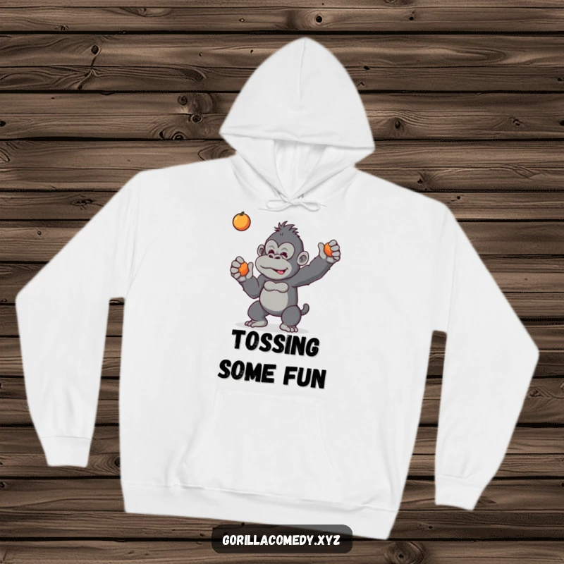 Funny hoodie with a mischievous gorilla tossing a piece of fruit, offering a cozy and playful primate-themed design.