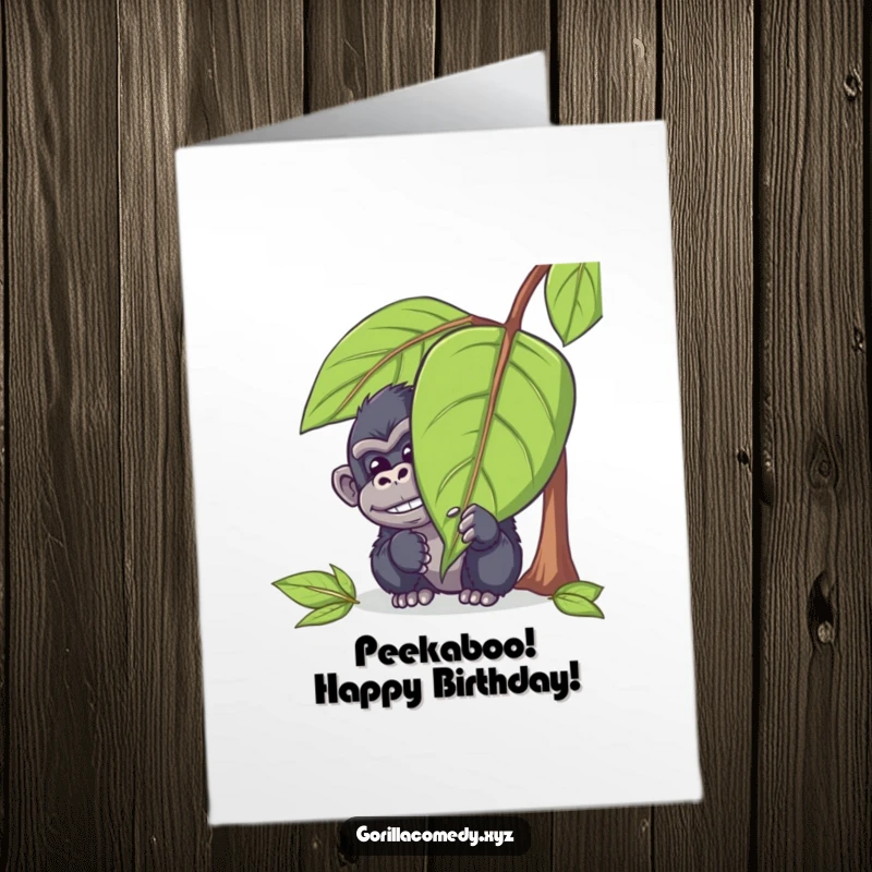Funny Free Printable Birthday Card showing a mischievous gorilla hiding behind a large leaf, peeking out with a chuckle, ready to surprise.