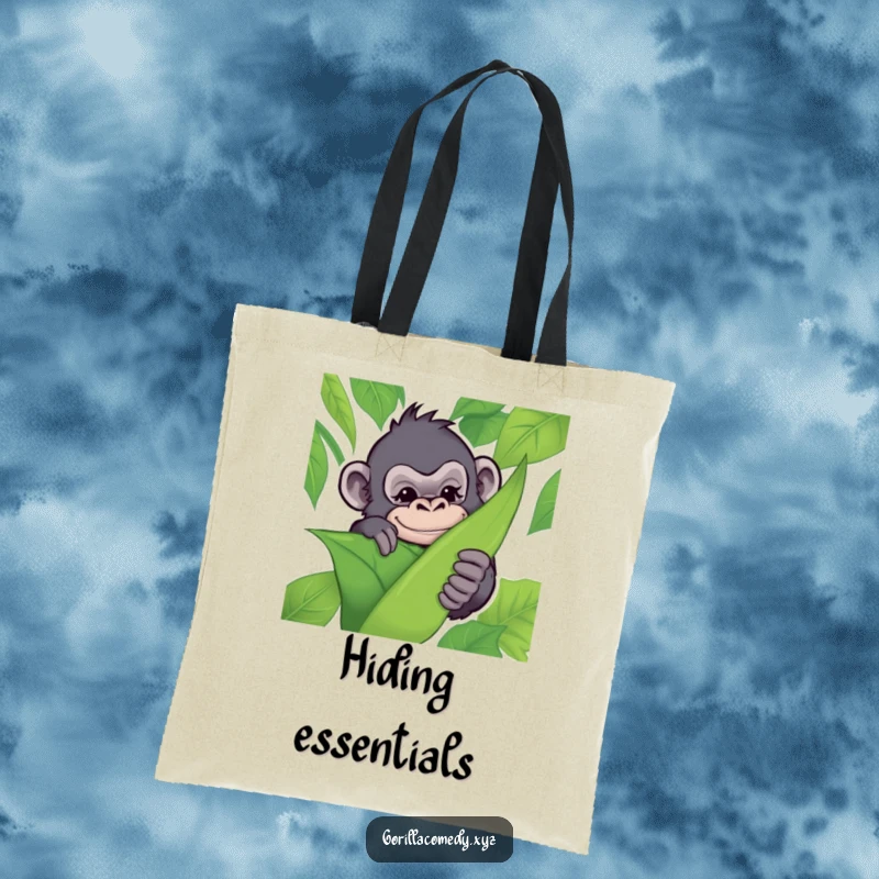 Funny tote bag with a mischievous gorilla peeking from behind a leaf with a wink, perfect for carrying essentials playfully.